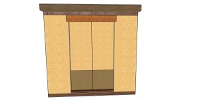 Tall wooden cabinet/armoire with beige textured panels, dark brown trim, and a small base drawer at the bottom.